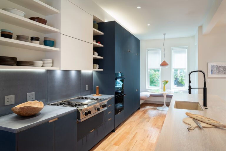 The kitchen was shifted to the street frontage, engaging an existing bay window as a window seat for family mealtimes.ARCHITECTURE: EL STUDIO PHOTOGRAPHY: Paul Burk