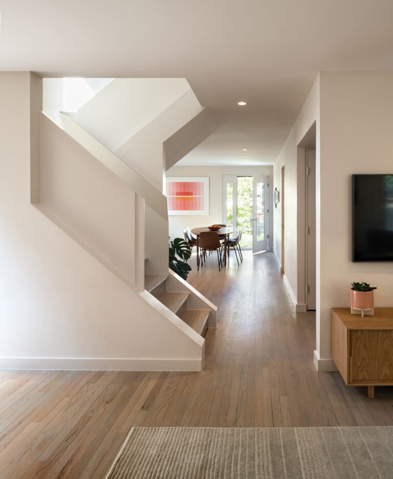 A wooden handrail was custom fabricated with 3D printed formwork to create an elegant ascent from public to private space.ARCHITECTURE: EL STUDIO PHOTOGRAPHY: Paul Burk