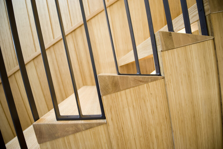 Open-riser stair treads are tuned to bounce light deep into the home interior.ARCHITECTURE: EL STUDIO PHOTOGRAPHY: Paul Burk
