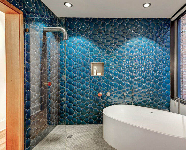 Natural wood tones and colorful tile embellish the guest bath. ARCHITECTURE: Carter + Burton Architecture, PLC PHOTOGRAPHY: Julie Roberts Home Team