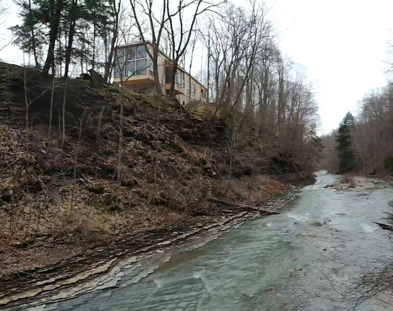 Carter + Burton designed a house in western New York State close to a rushing creek so the client could experience its visual and audio qualities from the safety of the residence. ARCHITECTURE: Carter + Burton Architecture, PLC PHOTOGRAPHY: WADE MICHAEL