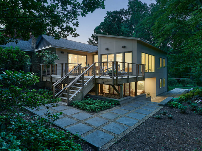 This 1960s ranch-style home addition in suburban DC created more open space for entertaining, with a sightline straight to the backyard. ARCHITECTURE: CARNEMARK design + build PHOTOGRAPHY: Anice Hoachlander
