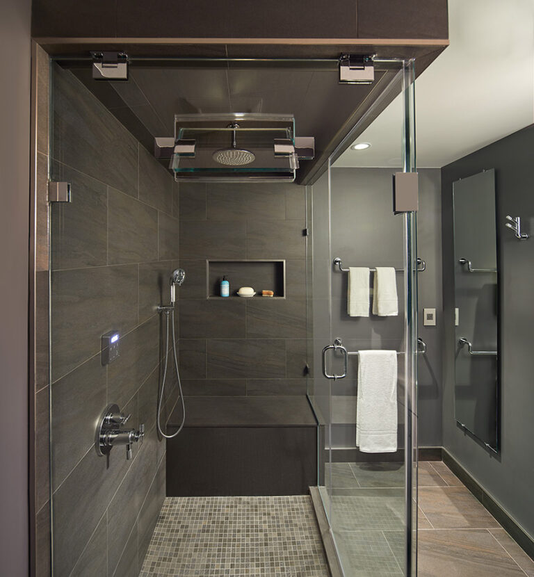 A handsome master spa with steam—features anthracite porcelain walls and floors and a frameless shower with a substantial bench for relaxing. ARCHITECTURE: CARNEMARK design + build PHOTOGRAPHY: Anice Hoachlander