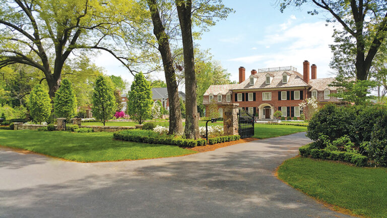 A natural stone retaining wall with ground cover creates a subtle but classic feature near a McLean driveway. LANDSCAPE ARCHITECTURE: Colao & Peter Outdoor Environments