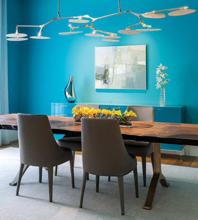 A turquoise Cappellini buffet is camouflaged on the wall of a Bethesda dining room; the BDDW dining table and Lindsey Adelman chandelier are piéces de resistance. INTERIOR DESIGN: ColePrévost PHOTOGRAPHY: Angie Seckinger
