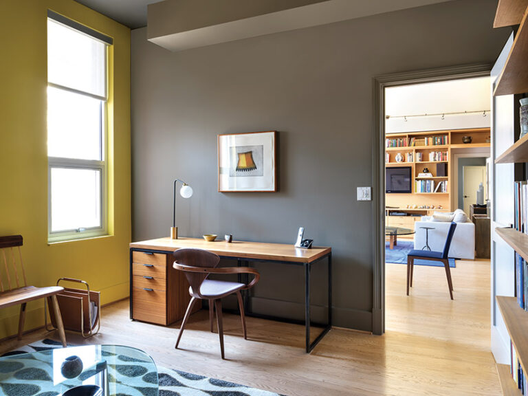 Cole and Prévost converted a guest room into a home office, where they designed the custom desk and magazine stand. INTERIOR DESIGN: ColePrévost PHOTOGRAPHY: ANGIE SECKINGER