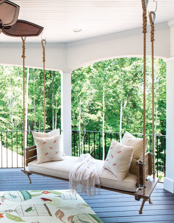 A custom daybed swing fosters relaxation on a second-floor terrace. INTERIOR DESIGN: Lorna Gross Interior Design PHOTOGRAPHY: Angie Seckinger