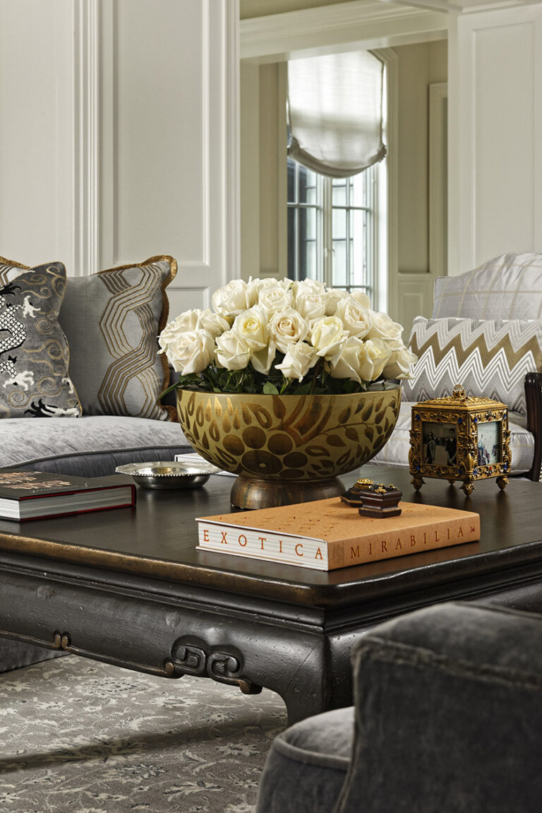 This vignette captures all the grace and grandeur this room evokes. Gold paired with grays elicits luxury. Detailed pillows in fabrics from Schumacher, Osborne & Little and Cowtan & Tout, luxurious custom sofas by Jonathan-Wesley. INTERIOR DESIGN: MAX Interiors PHOTOGRAPHY: Bob Narod