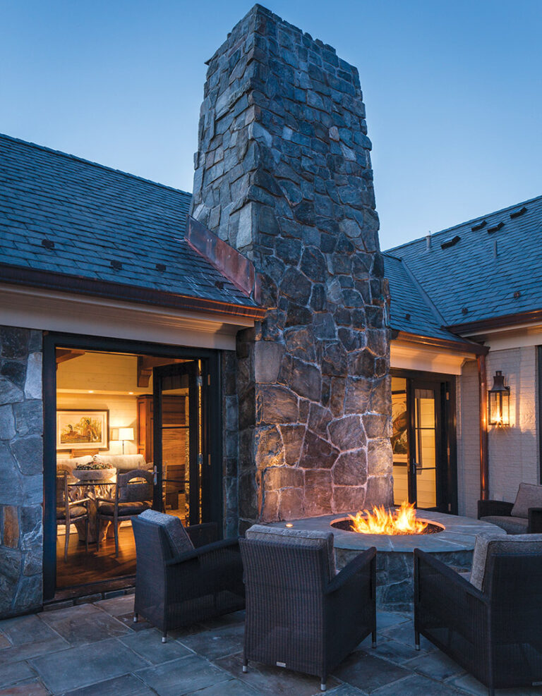 The sweep of the surrounding woods is accentuated by large patios designed for entertainment and quiet reflection. INTERIOR DESIGN: Monarch PHOTOGRAPHY: Lydia Cutter