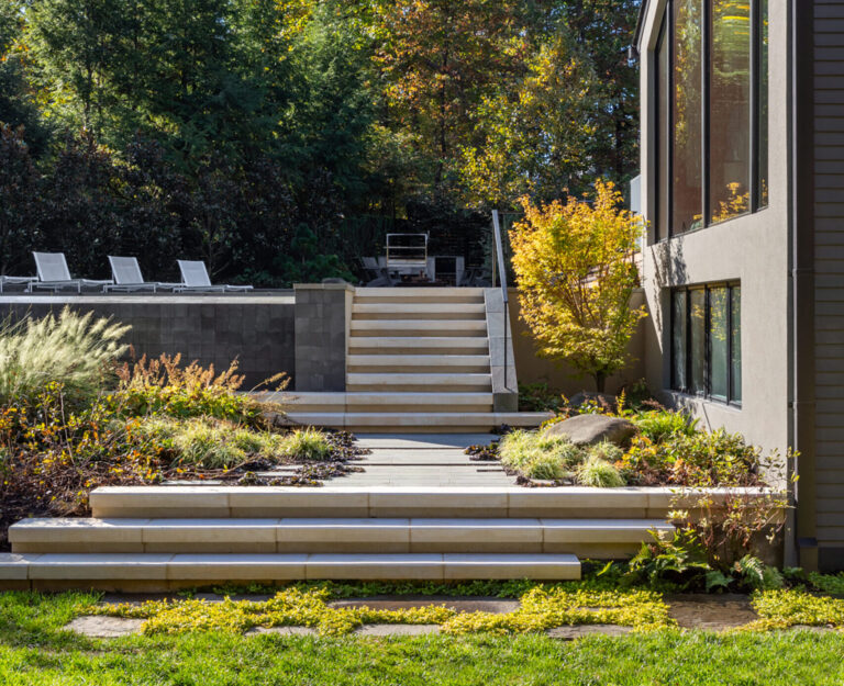 Meticulous architectural updates over the years in McLean, Virginia, set the stage for an equally refined landscape. Influenced by bold Mid-Century geometry and dramatic plantings, clean lines define the pool, terrace, dining patio, and steps.LANDSCAPE ARCHITECTURE: Joseph Richardson Landscape Architecture PHOTOGRAPHY: Kate Wichlinski