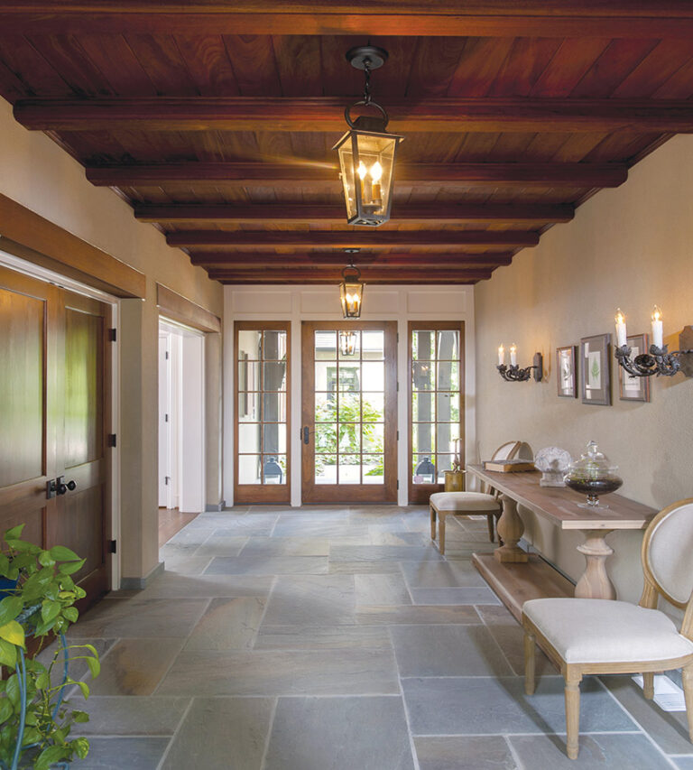 The same slate  floor flows from the front courtyard through the foyer and onto the rear terrace, helping to create a breezeway effect. ARCHITECTURE: Rill Architects PHOTOGRAPHY: Michael Ventura
