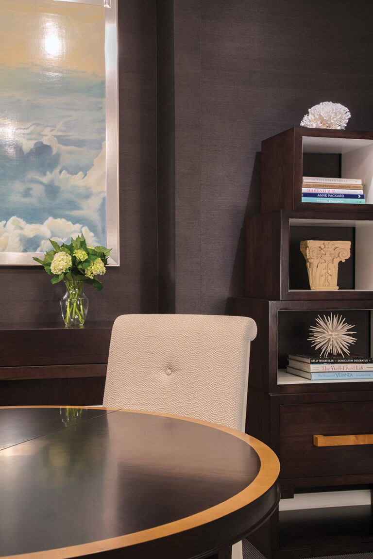 Homeowners gather around a round table to work or dine. A handy file drawer in the stacker bookcase stows unwanted papers out of sight. INTERIOR DESIGN: Sroka Design Incorporated PHOTOGRAPHY: Geoffrey Hodgdon