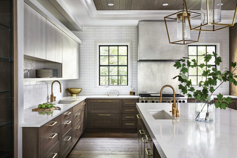 The clean-lined kitchen balances a custom stainless-steel hood with warm wood tones, a custom light shelf and views to the landscape.ARCHITECTURE: Studio 360 LLC PHOTOGRAPHY: Stacy Zarin Goldberg