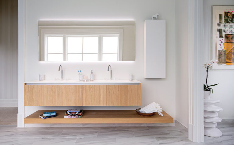 A soothing primary bath elevates everyday rituals with European-sourced fittings and furniture. ARCHITECTURE: CARNEMRK design. + build PHOTOGRAPHY: Ron Blunt