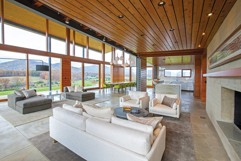 Interiors feature high ceilings, LED lighting and radiant-heat floors. Southern porches, acoustical engineering and hidden functional support spaces create a unique project that is reinforced with quality craftsmanship and detailing. ARCHITECTURE: Carter + Burton Architecture, PLC PHOTOGRAPHY: Daniel Afzal