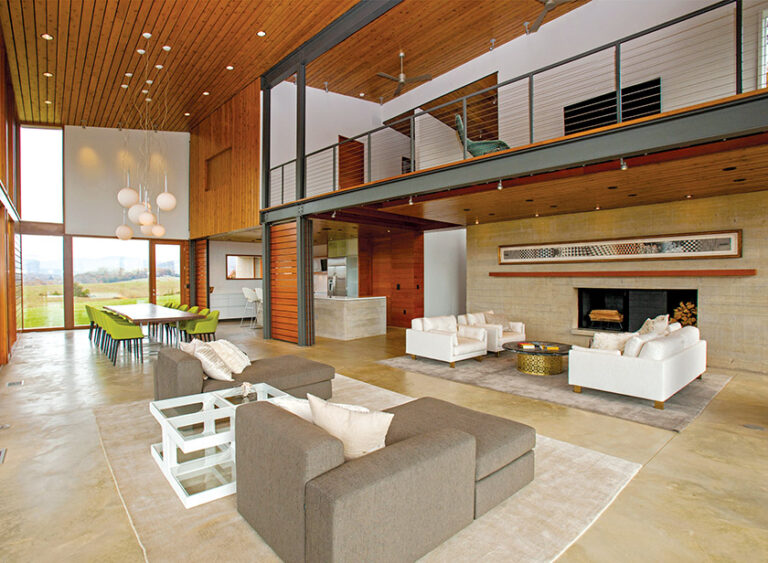 Interiors feature high ceilings, LED lighting and radiant-heat floors. Southern porches, acoustical engineering and hidden functional support spaces create a unique project that is reinforced with quality craftsmanship and detailing. ARCHITECTURE: Carter + Burton Architecture, PLC PHOTOGRAPHY: Daniel Afzal