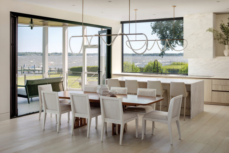 An accordion door leads out to a screened porch. ARCHITECTURE: The Drawing Board, Inc. PHOTOGRAPHY: Jennifer Hughes