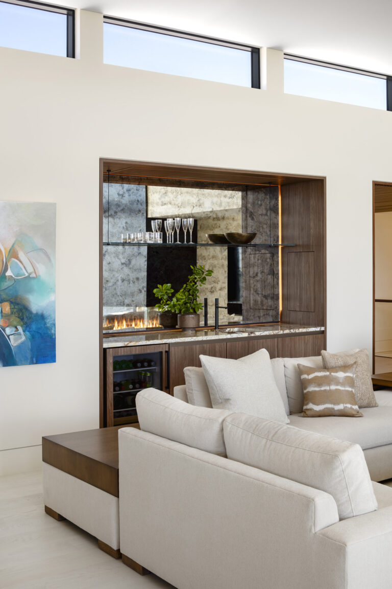 A wet bar in the living room provides convenience as well as an eye catching backdrop.ARCHITECTURE: The Drawing Board, Inc. PHOTOGRAPHY: Jennifer Hughes