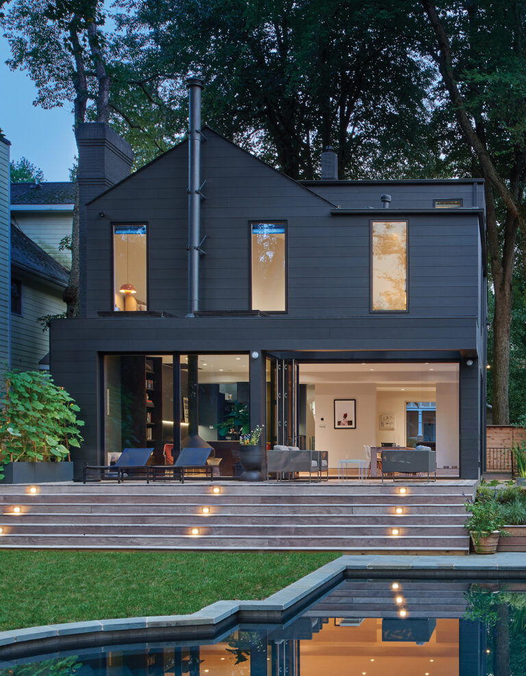 A wood-burning fireplace connects to the porch via expanded apertures. ARCHITECTURE: EL STUDIO PHOTOGRAPHY: Anice Hoachlander