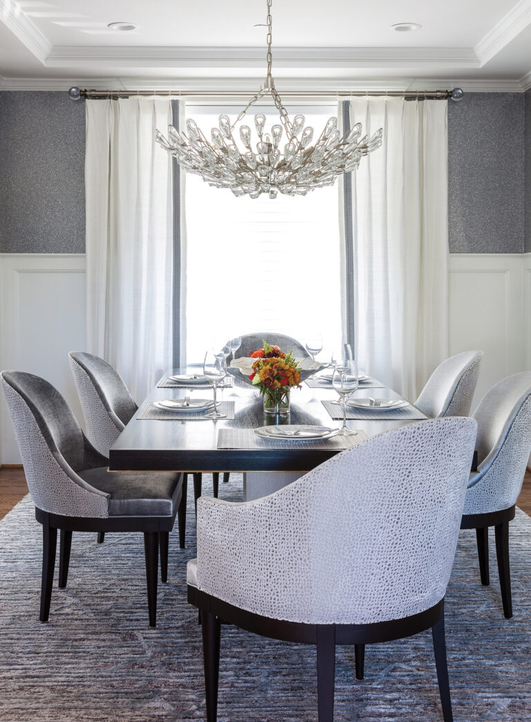 A Bethesda dining room layers various textures, including a mica wallcovering and silk drapery, to elegant effect. INTERIOR DESIGN: Samantha Friedman Interior Designs, LLC PHOTOGRAPHY: Gwin Hunt