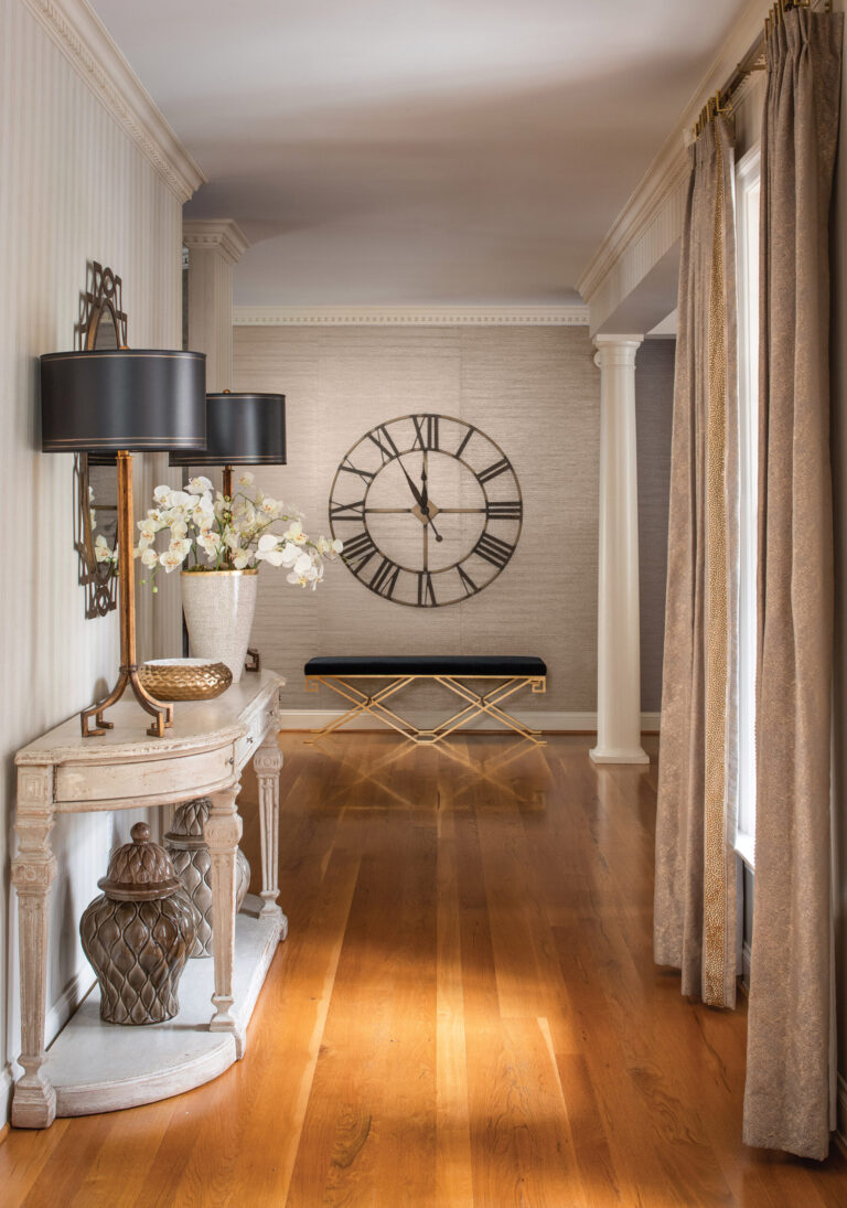 Hand-woven silk wall covering dresses up the foyer. INTERIOR DESIGN: Amanda Friend Interior Design PHOTOGRAPHY: Robert Radifera