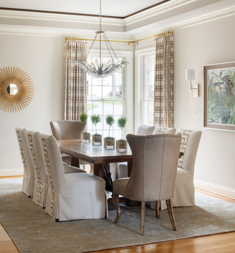 In a Georgian-style Easton, Maryland, mansion, Friend designed slipcovered dining room chairs with a velvet Greek key border on their backs. INTERIOR DESIGN: Amanda Friend Interior Design PHOTOGRAPHY: Robert Radifera