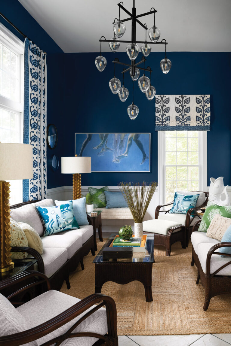 She embellished a pool house in shades of blue; Pindler and Kravet outdoor upholstery resists wet bathing suits. INTERIOR DESIGN: Amanda Friend Interior Design PHOTOGRAPHY: Robert Radifera