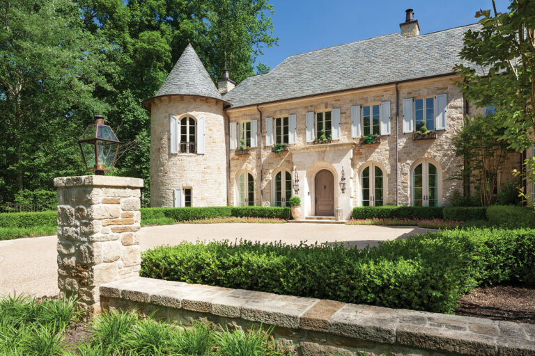 With its peaked turret, stone façade and charming, light blue shutters, this Norman-style residence in Vienna, Virginia, would look perfectly at home in the French countryside. ARCHITECTURE: Harrison Design PHOTOGRAPHY: Gordon Beall