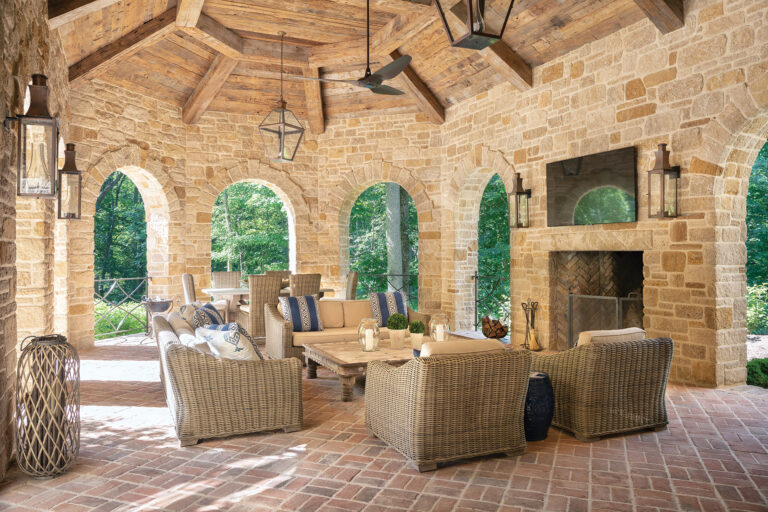 Abundant archways connect the loggia, with its timbered, vaulted ceiling, to the terrace, pool and landscape beyond. ARCHITECTURE: Harrison Design PHOTOGRAPHY: Gordon Beall