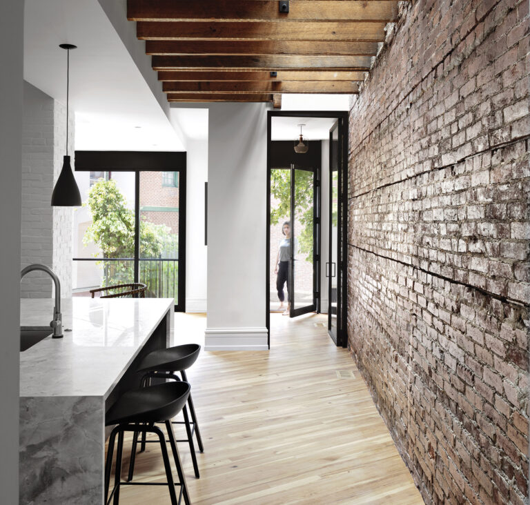 A great room in a newly renovated home opens to a sunken courtyard for easy indoor/outdoor entertaining; colorful pan-els reflect the youthful owners’ playful aesthetic. ARCHITECTURE: Colleen Healey Architecture PHOTOGRAPHY: Jen-nifer Hughes