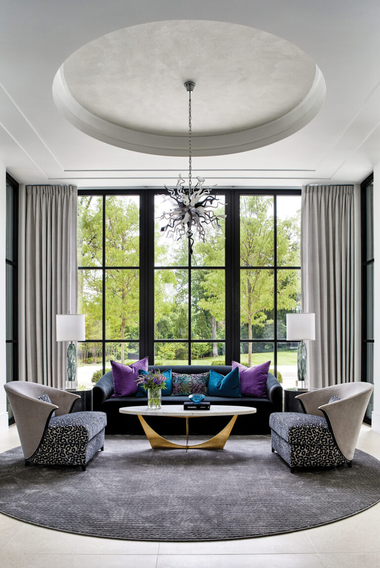 A contemporary sitting room captivates with vivid color and a Chihuly-style light fixture. INTERIOR DESIGN: Interior Concepts, Inc. PHOTOGRAPHY: Stacy Zarin Goldberg