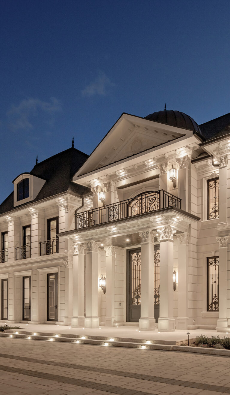 A grand estate in Potomac showcases a detailed cast-stone façade and balconies; a dome above the entry gable houses a two-story foyer and rotunda.