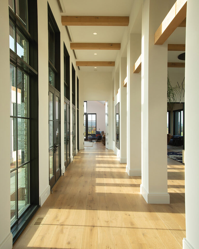 A 16-foot-tall gallery linking the central courtyard to the living spaces of a Virginia residence allows jaw-dropping views of the countryside.