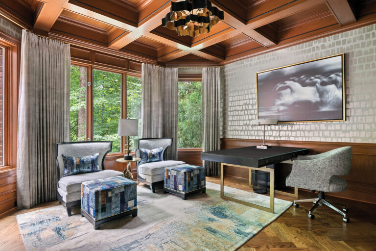 The mahogany-paneled study with Phillip Jeffries wall covering features seating from Baker and a Tufenkian rug.