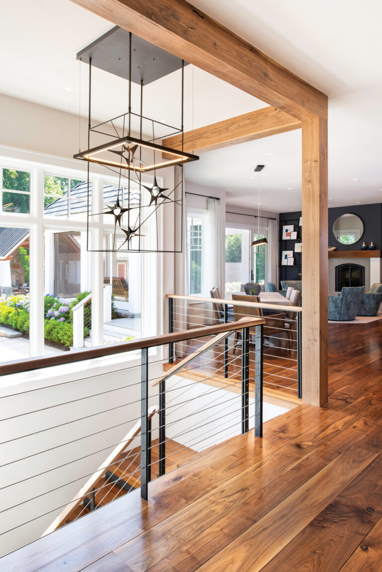 A custom Hubbardton Forge light fixture and 10-inch-wide-plank walnut floors enhance the upstairs living area. INTERIOR DESIGN: Sandra Meyers Design Studio PHOTOGRAPHY: Maxine Schnitzer