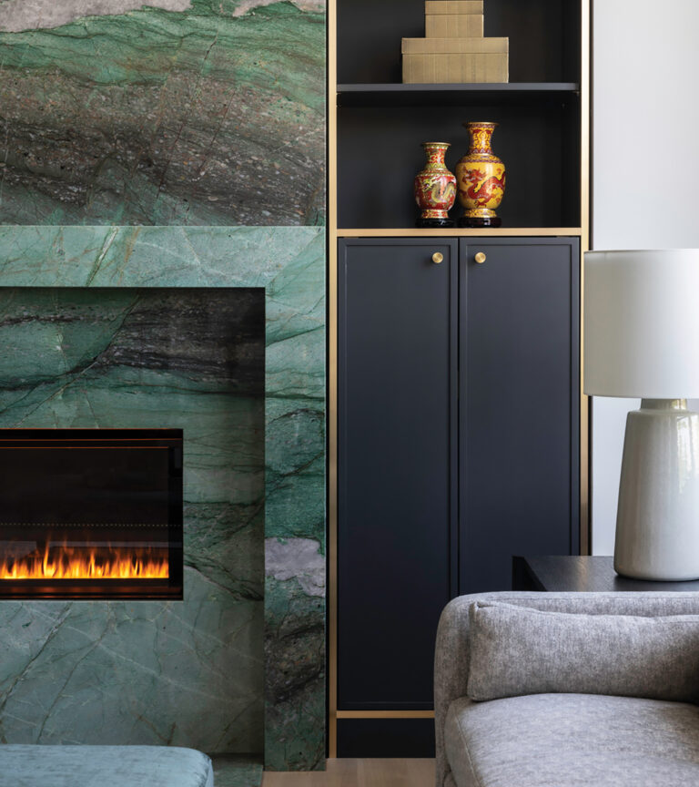 A luxe stone fireplace surround and custom built-ins elevated a Reston, Virginia, condo.